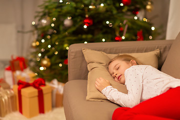 Image showing girl sleeping on sofa at christmas