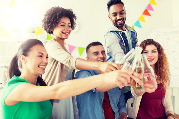 Image showing happy team with drinks celebrating at office party