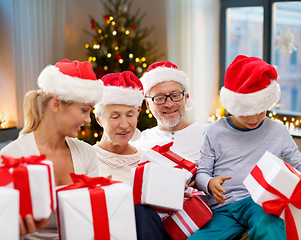 Image showing happy family with christmas gifts at home