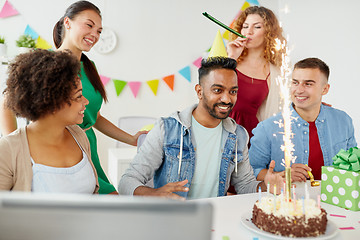 Image showing office team greeting colleague at birthday party