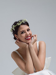 Image showing young bride sitting in a wedding dress