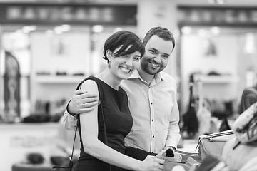 Image showing couple chooses shoes At Shoe Store