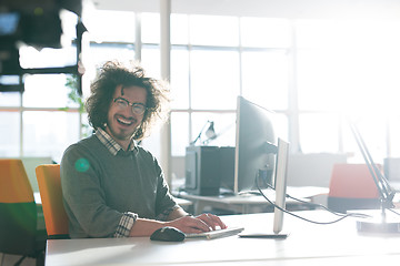 Image showing businessman working using a computer in startup office