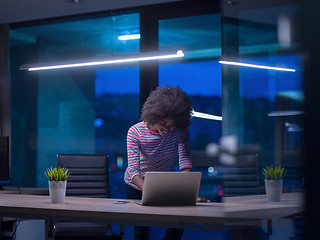 Image showing black businesswoman using a laptop in startup office