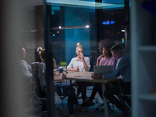 Image showing Multiethnic startup business team in night office