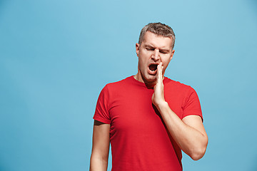 Image showing Beautiful bored man bored isolated on blue background