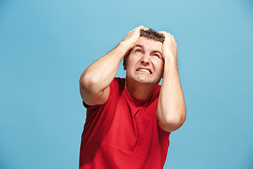 Image showing Handsome man in stress isolated on blue