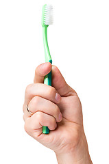 Image showing Hand with toothbrush on white 