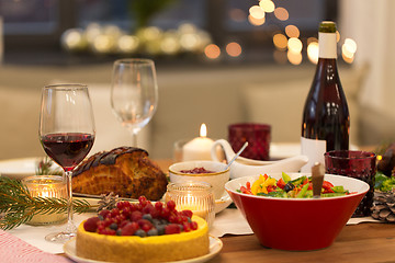 Image showing food and drinks on christmas table at home