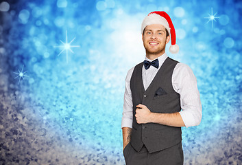 Image showing happy man in santa hat and suit on christmas