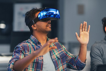 Image showing man in virtual reality headset at night office