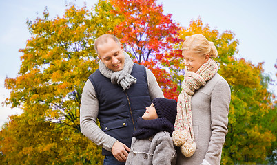 Image showing happy family over autumn park background