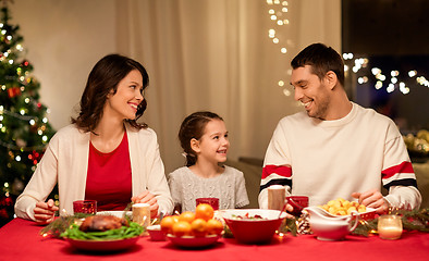 Image showing happy family having christmas dinner at home