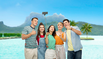 Image showing friends taking selfie by smartphone over bora bora