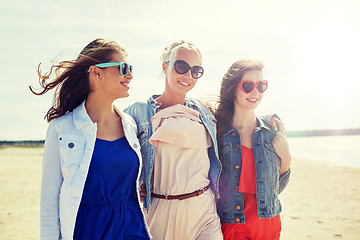 Image showing group of smiling women in sunglasses on beach