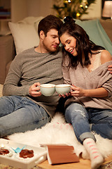 Image showing happy couple drinking cacao at home