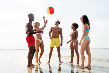 Image showing friends playing with beach ball in summer