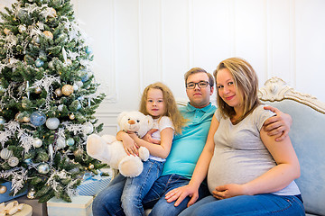 Image showing Family portrait near christmas tree