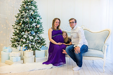 Image showing Family portrait near christmas tree