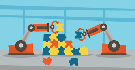 Image showing Two robotic arms building a colorful puzzle.