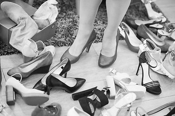 Image showing woman sitting in shoe store