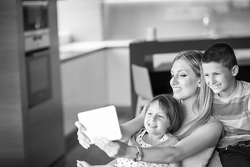 Image showing Young Family Using A Tablet To Make Future Plans