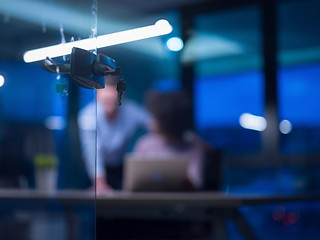 Image showing Multiethnic startup business team in night office