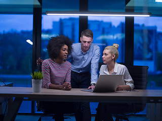 Image showing Multiethnic startup business team in night office