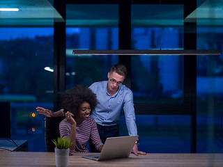 Image showing Multiethnic startup business team in night office