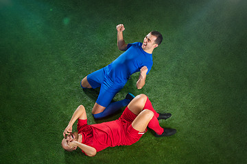 Image showing Happy and unhappy football players after goal