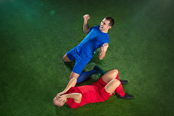 Image showing Happy and unhappy football players after goal