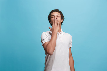 Image showing Portrait of attractive afro man with kiss isolated over blue background