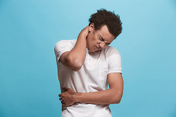 Image showing Young man overwhelmed with a pain in the necks
