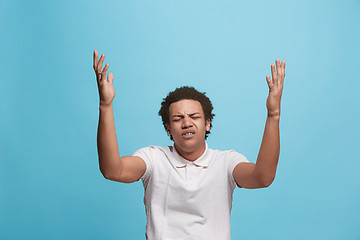 Image showing Beautiful man looking suprised and bewildered isolated on blue