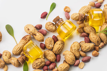 Image showing Natural peanut with oil in a glass