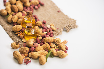 Image showing Natural peanut with oil in a glass