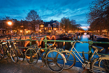 Image showing Amterdam canal, bridge and medieval houses in the evening