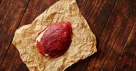 Image showing Piece of raw meat on paper napkin