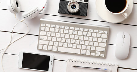 Image showing Gadgets and cup of coffee