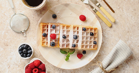 Image showing Waffles served on plate with berries