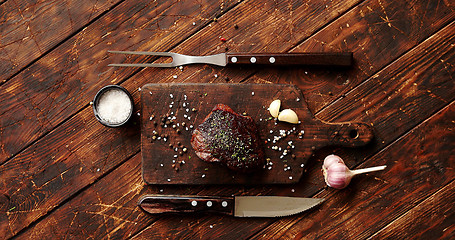 Image showing Piece of meat on chopping board