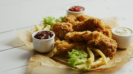Image showing Fresh sauces near fried chicken wings