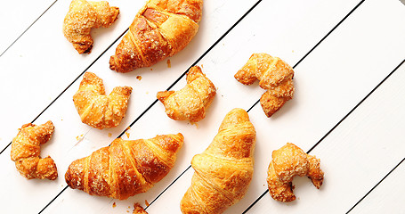 Image showing Various croissants lying on table 