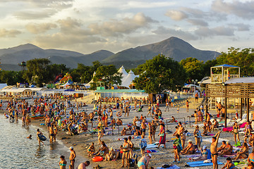 Image showing A lot of resting people are on the sea beach