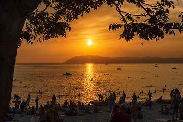 Image showing Tourists enjoy the sunset on the beach on Black sea