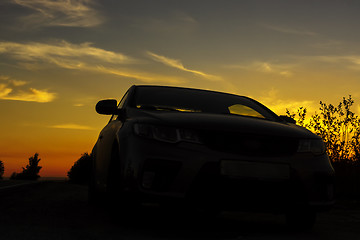 Image showing Overnight stopover of traveling car on roadside at sunset