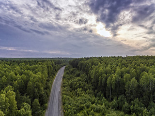 Image showing Aerial view of old asphalt road through wild forest