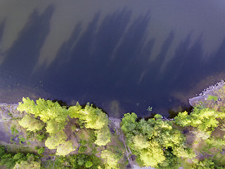 Image showing Aerial view on wild pond in forest in summer day