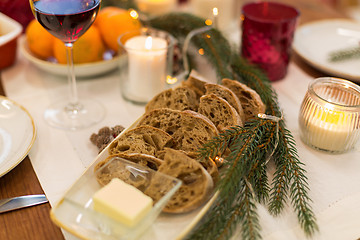 Image showing bread slices and other food on christmas table