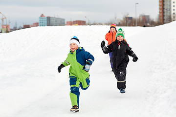 Image showing happy little kids playing outdoors in winter